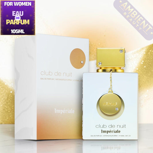 Club de Nuit White Imperiale perfume bottle and packaging on a reflective surface with a blurred background.