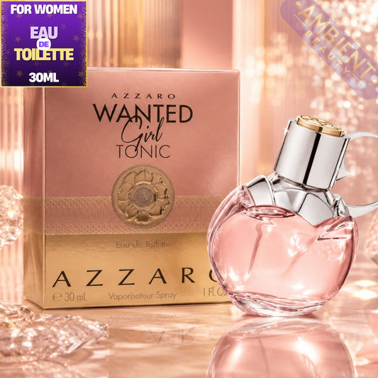 Azzaro Wanted Girl Tonic perfume bottle and packaging on a reflective surface with sparkling background