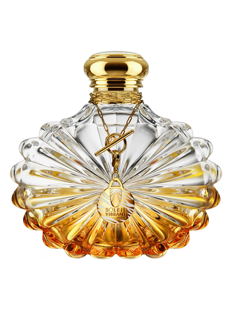 Perfume bottle with gold cap and detailed design on a white background