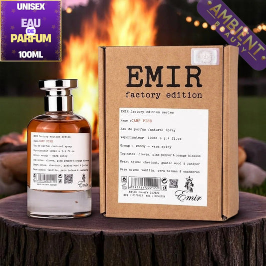A bottle of Emir Factory Edition Series Sant Piase Eau de Parfum next to its cardboard packaging box, displayed on a rustic wooden surface with a blurred warm background.