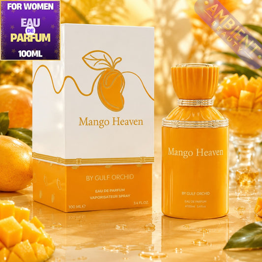 Mango Heaven perfume bottle and packaging with mangoes in the background