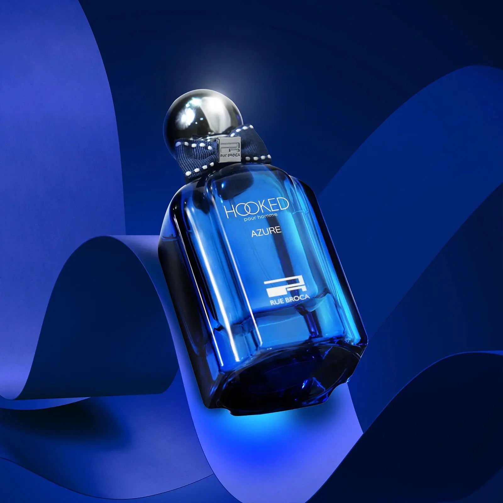 Blue perfume bottle labeled 'Hooked Azure' on a blue background