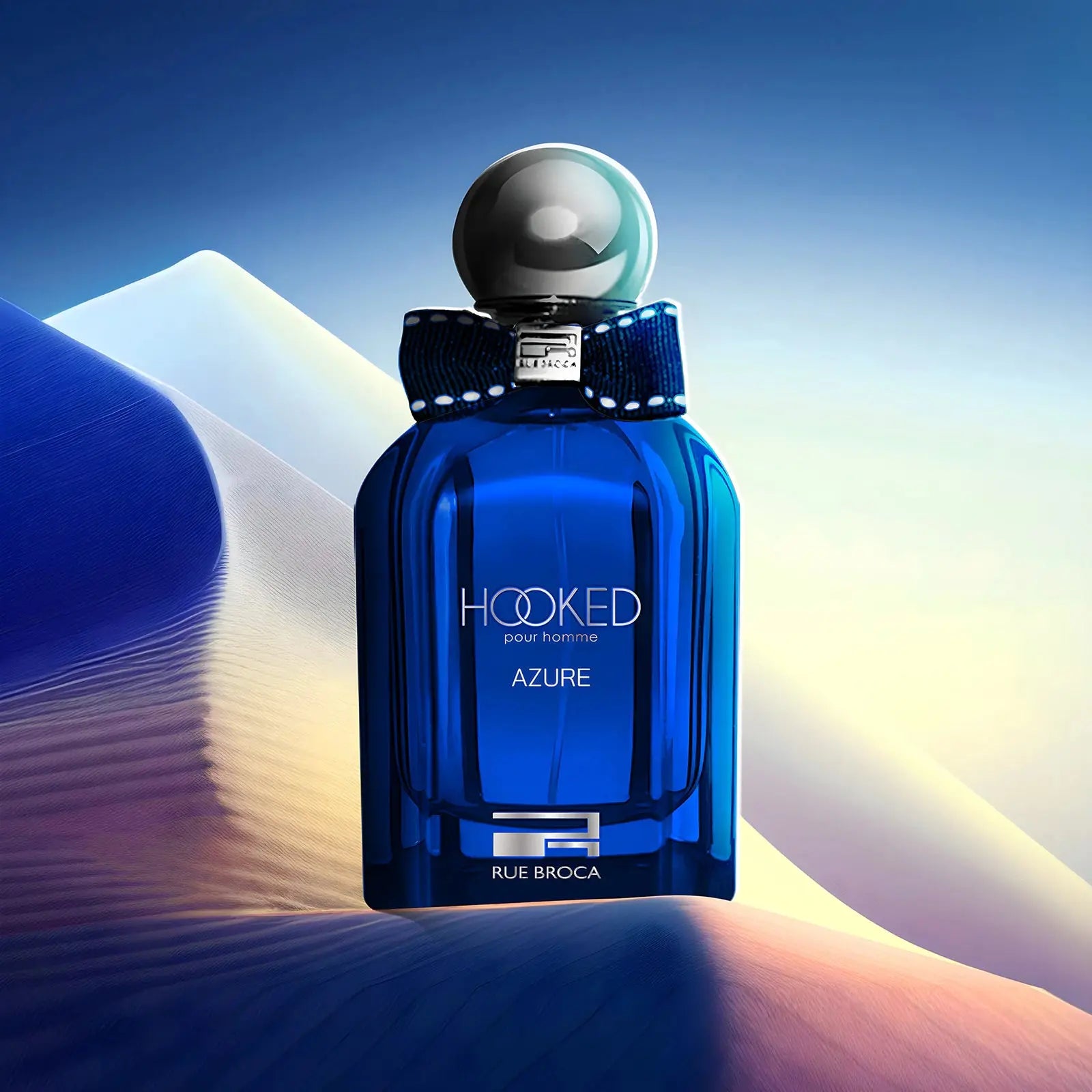 Blue perfume bottle labeled 'Hooked Azure' on a gradient background