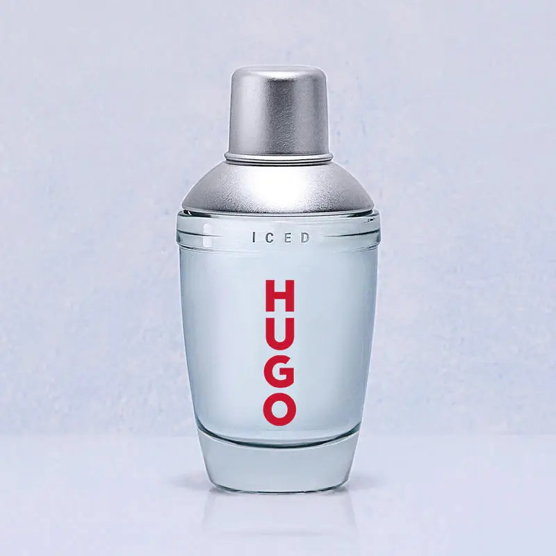 Hugo Boss perfume bottle with silver cap and red text on a light gray background