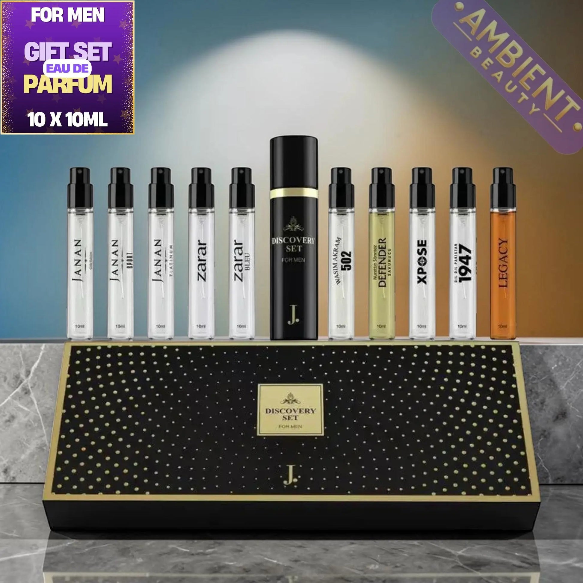 Junaid Jamshed Discovery Set Men's perfume gift set with various bottles and a black box on a gray surface.