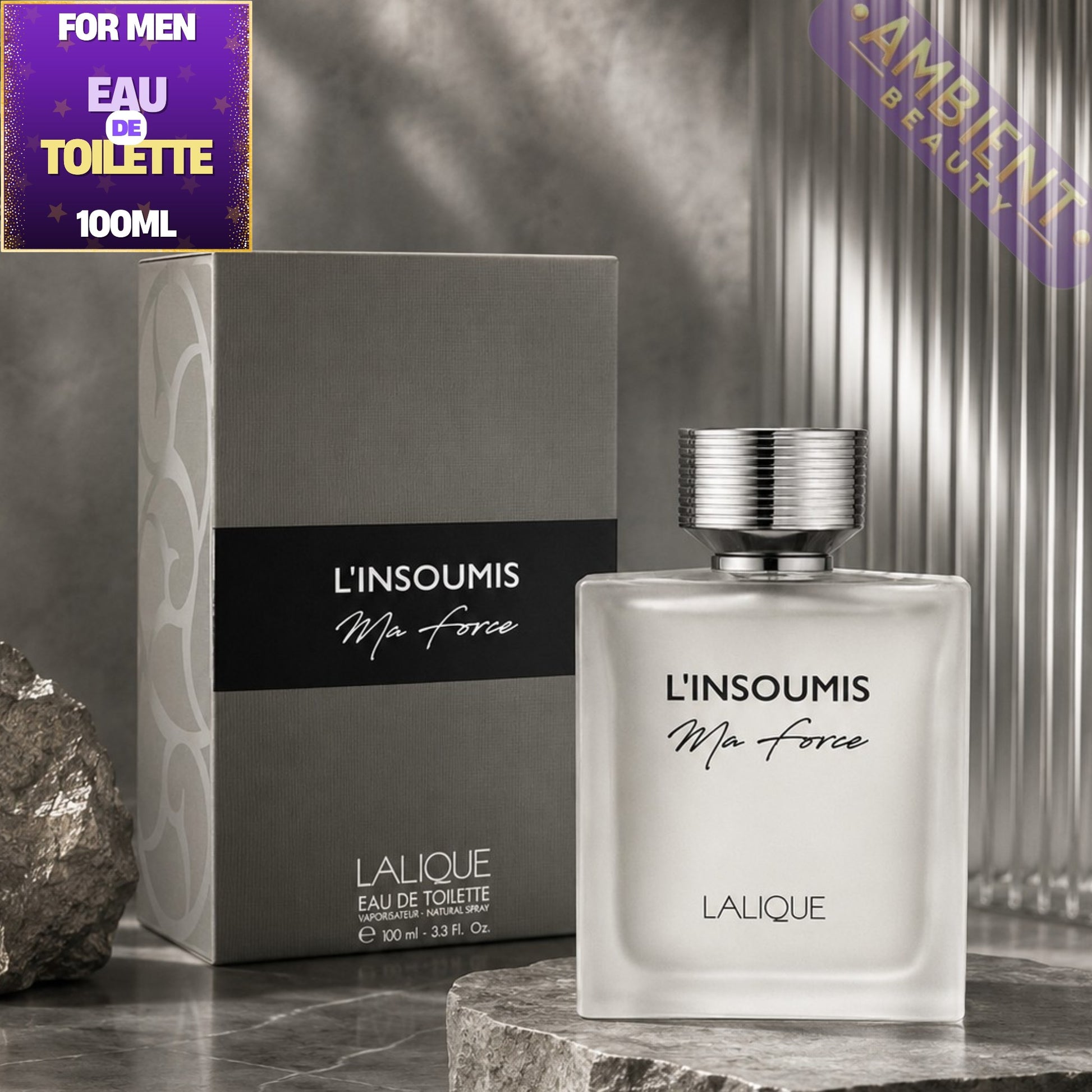Lalique L'Insoumis perfume bottle and packaging on a gray surface with decorative elements.
