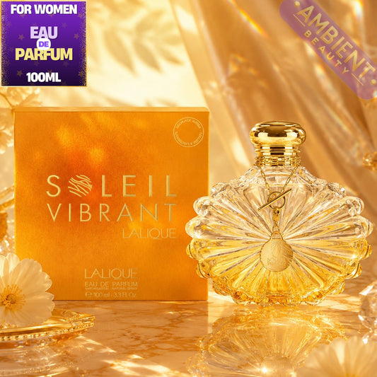 Lalique Soleil Vibrant perfume bottle and packaging on a reflective surface with 'Ambient Beauty' branding.