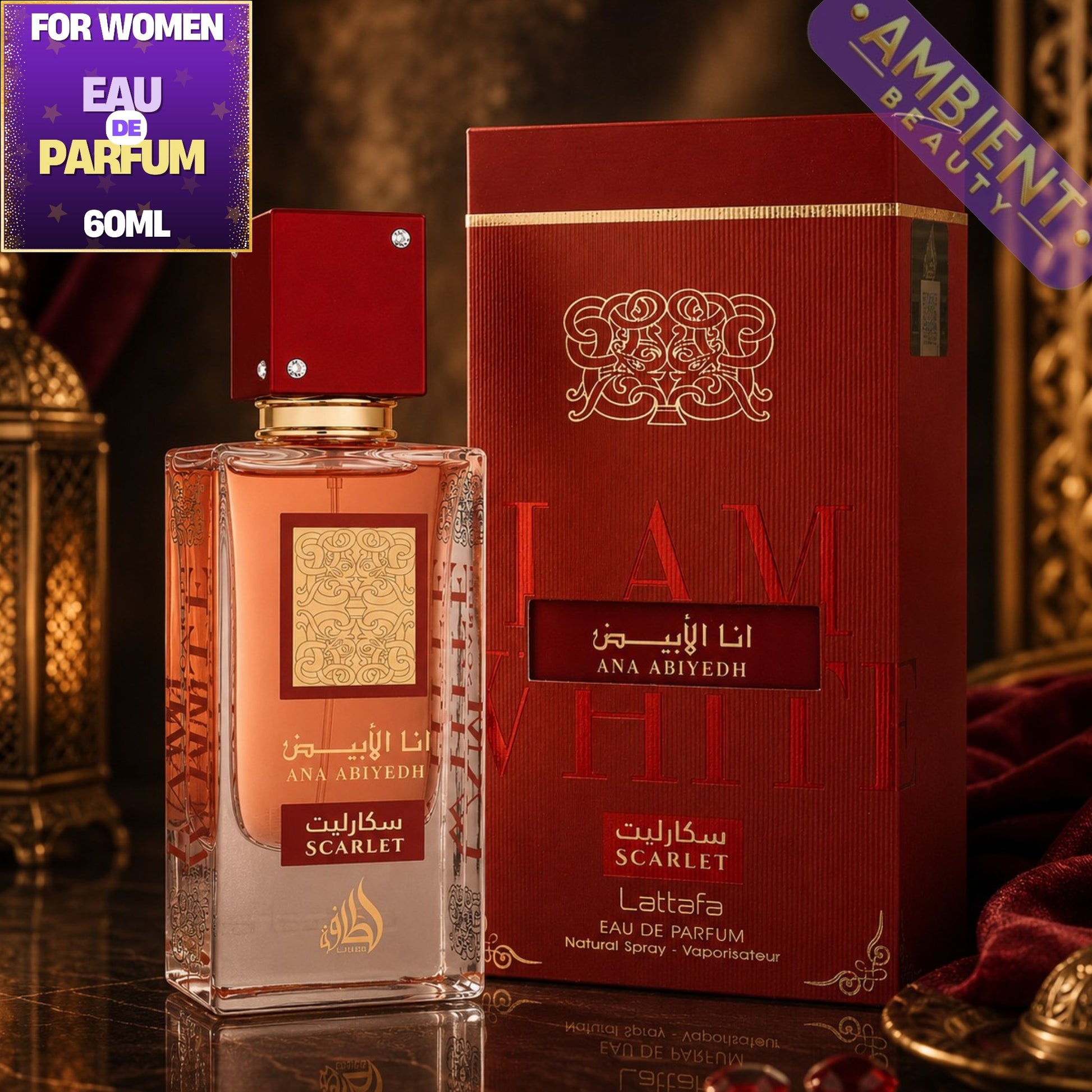 Lattafa Ana Abiyedh Scarlet red perfume bottle and packaging with 'Ambient Beauty' branding on a dark backgroundb