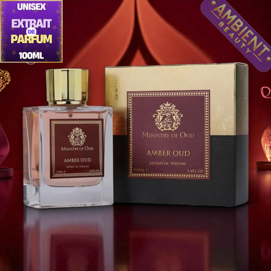 A 100ml bottle of Ministry of Oud Amber Oud Extrait de Parfum next to its packaging box, set against a dark red background with decorative purple promotional badges.