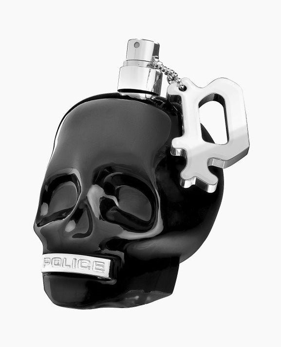 Black skull-shaped perfume bottle with silver accents on a white background