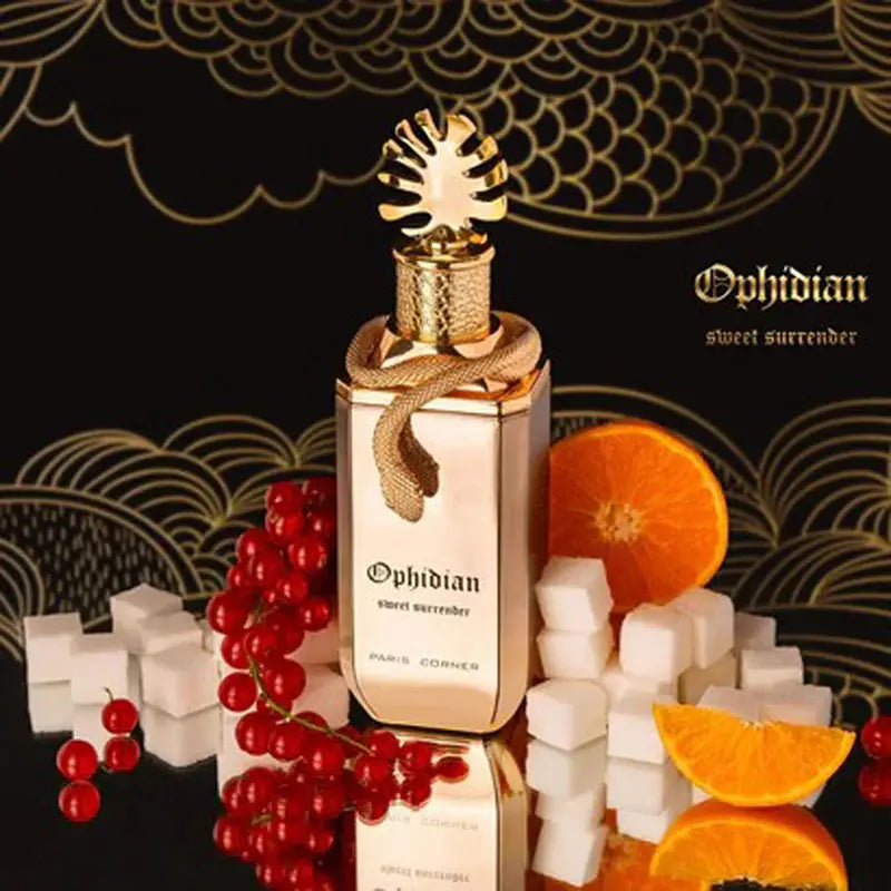 Ophidian perfume bottle with fruits and sugar cubes on a decorative background