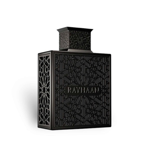 Black perfume bottle with intricate design on a white background