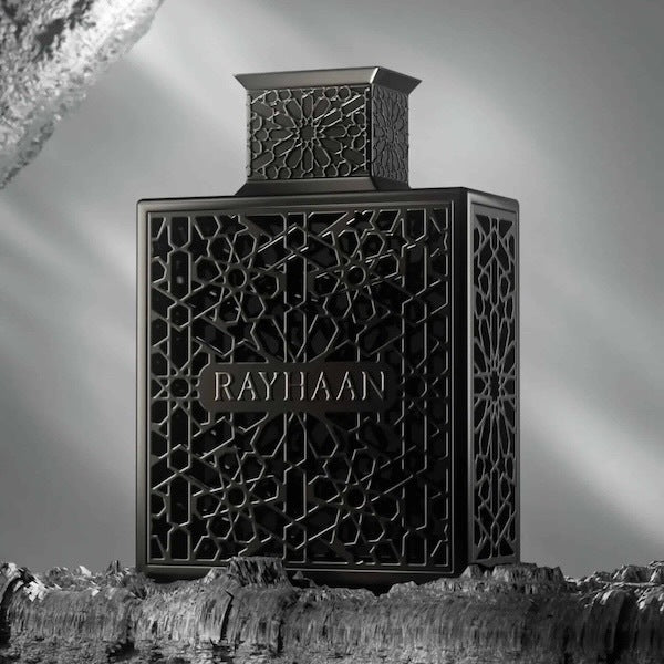 Black decorative bottle with intricate patterns and 'RAYHAAN' branding against a gray background.