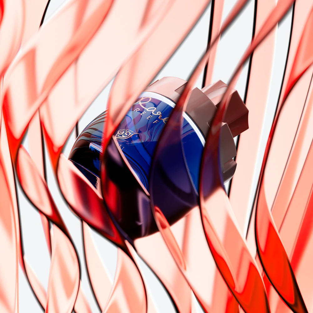 Close-up of a perfume bottle with abstract red and white background