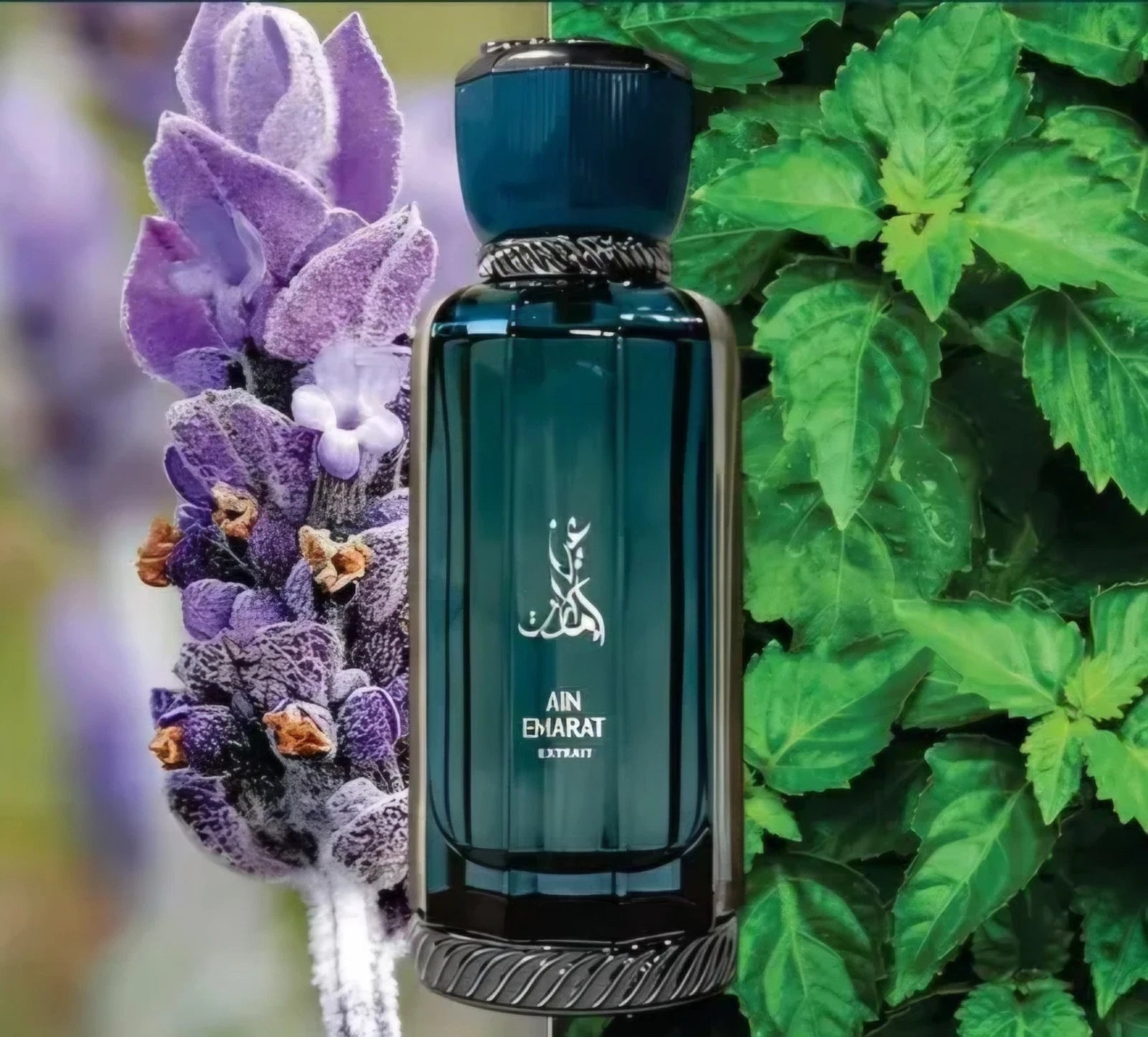 A dark teal glass perfume bottle labeled AIN EMARAT EXTRACT, styled with a lavender flower on the left and green leaves on the right.