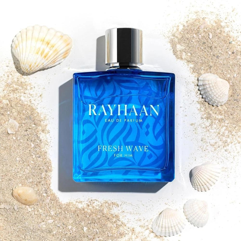 Rayhaan Fresh Wave Blue Rayhaan Fresh Wave perfume bottle on sand with shells