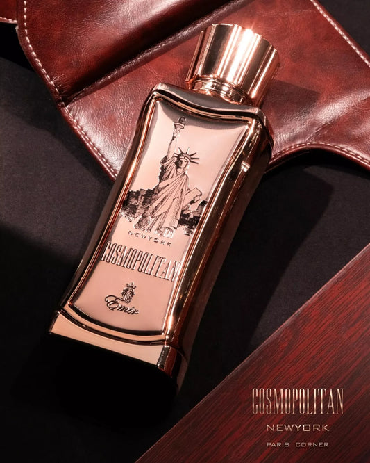 Emir Cosmopolitan New York perfume bottle with rose gold design on a dark surface