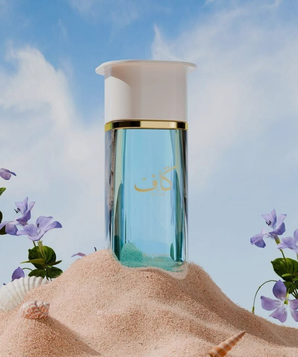 Ahmed Al Maghribi Kaaf bottle with sand and flowers on a beach