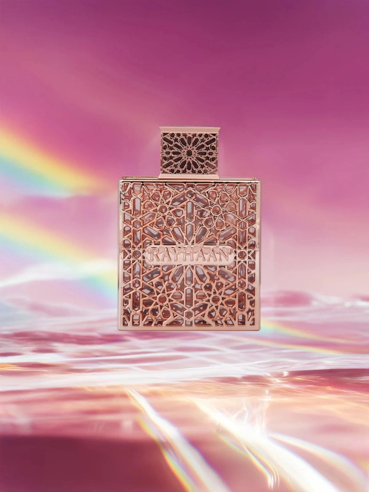 Rayhaan Divine Decorative perfume bottle with intricate design on a pink and purple gradient background with rainbow effect