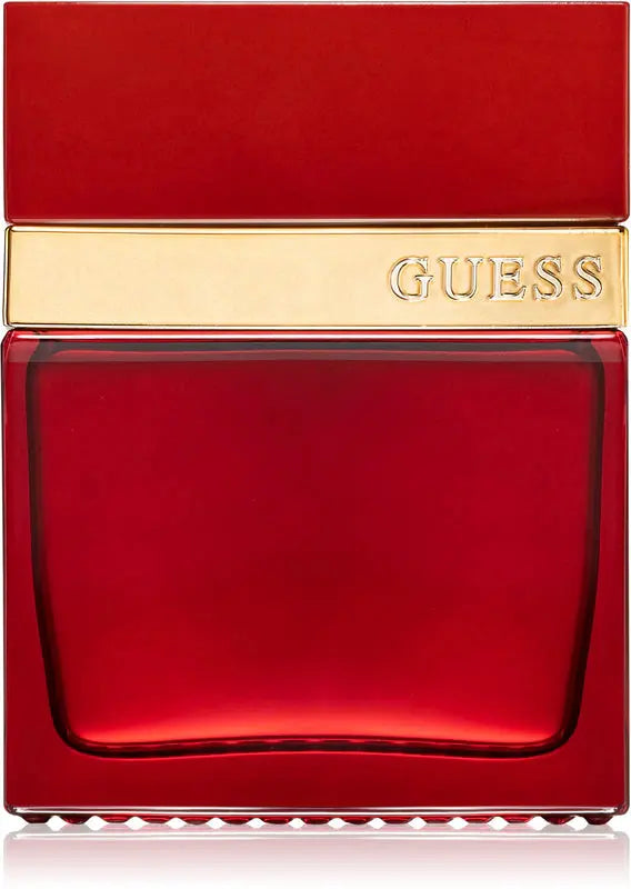 Red Guess perfume bottle with gold cap on a white background