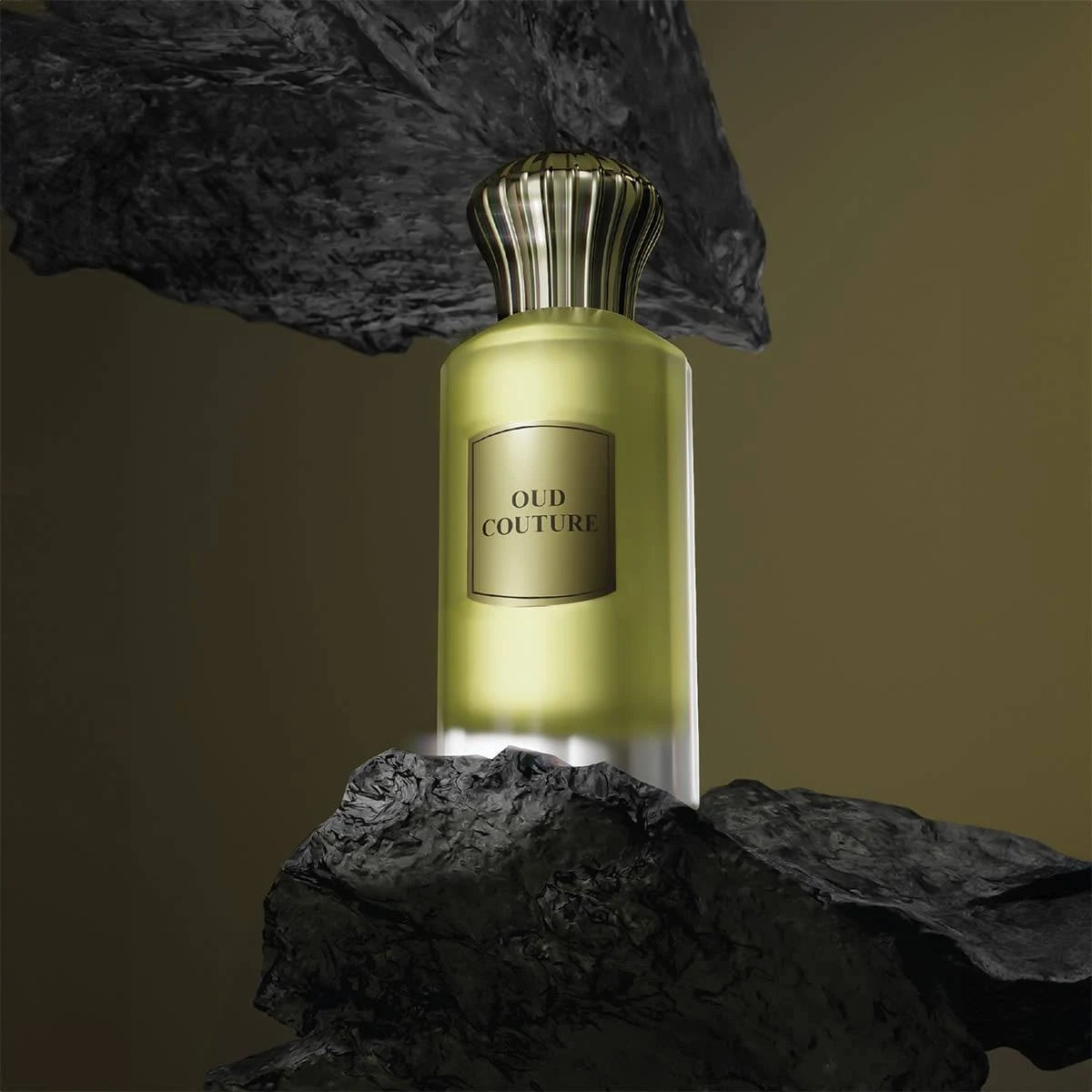 Ahmed Al Maghribi Oud Couture Perfume bottle labeled 'Oud Couture' on a dark rock background