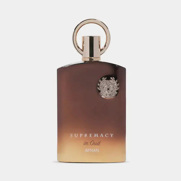 Perfume bottle labeled 'Supremacy in Oud' by Afnan on a white background