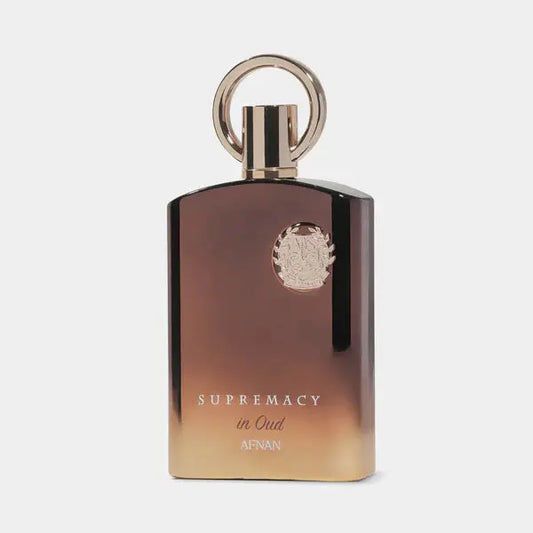 Perfume bottle labeled 'Supremacy in Oud' by Afnan on a light gray background
