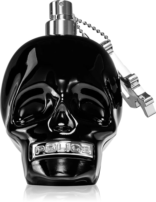 Black skull-shaped police perfume bottle on a white background