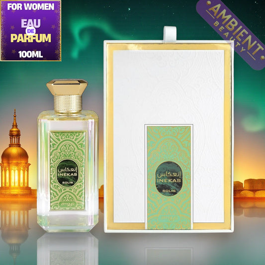 Zimaya Inekas Solis perfume bottle and packaging with decorative elements on a green background