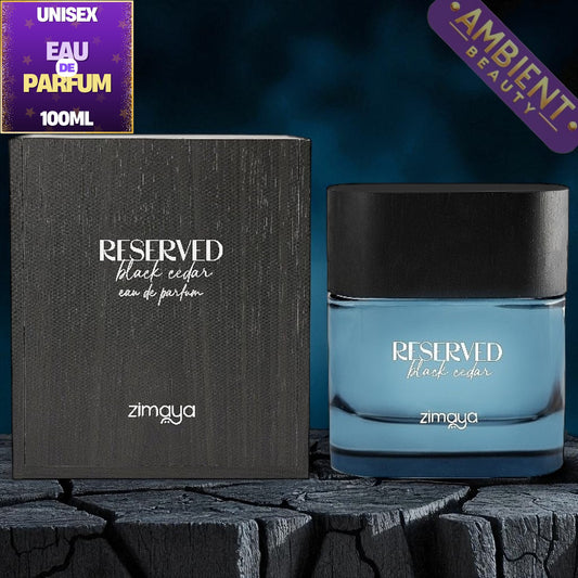 Blue perfume bottle with black cap and 'Reserved Black Cedar' text, alongside packaging and 'Ambient Beauty' watermark.